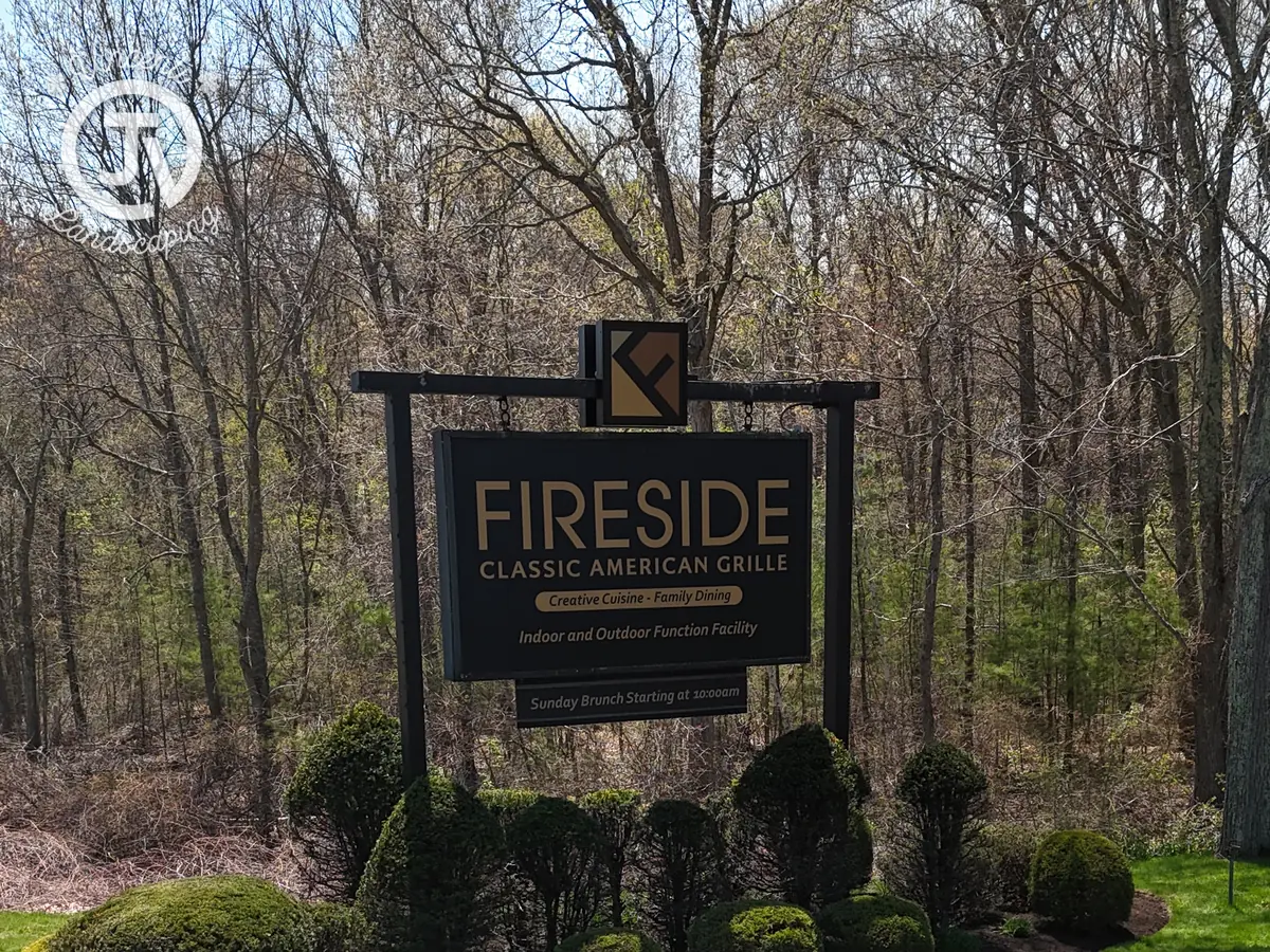 Commercial entrance sign planting in Middleborough, MA by Vincenti Landscaping