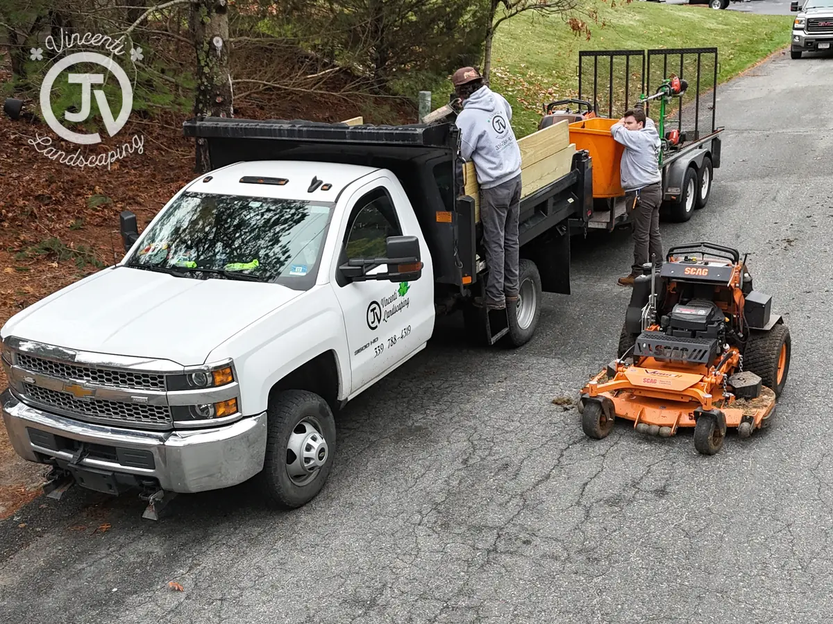 Vincenti Landscaping crew loading mowers on a weekly route
