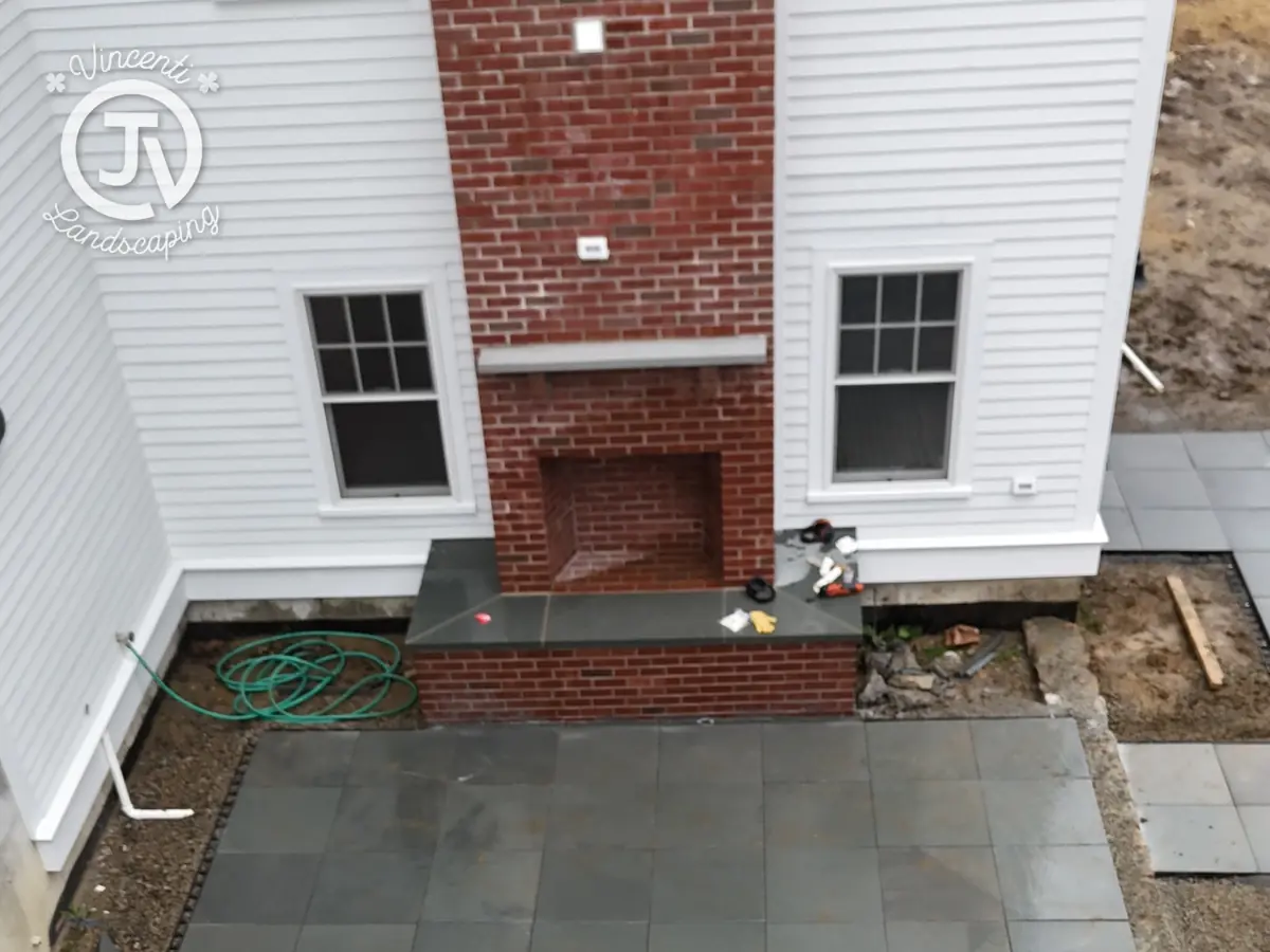 Bluestone patio installed at a Scituate, MA home by Vincenti Landscaping