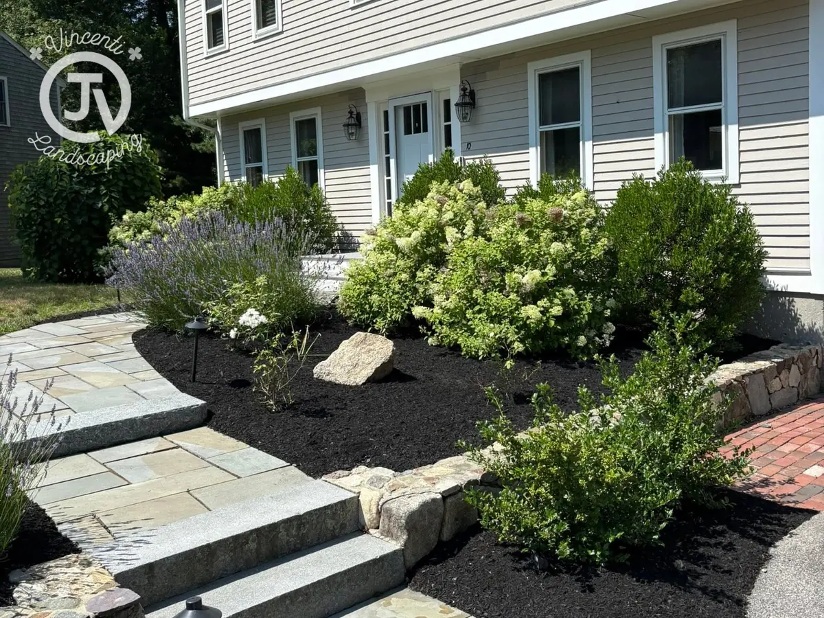 Stone steps and planting beds by Vincenti Landscaping